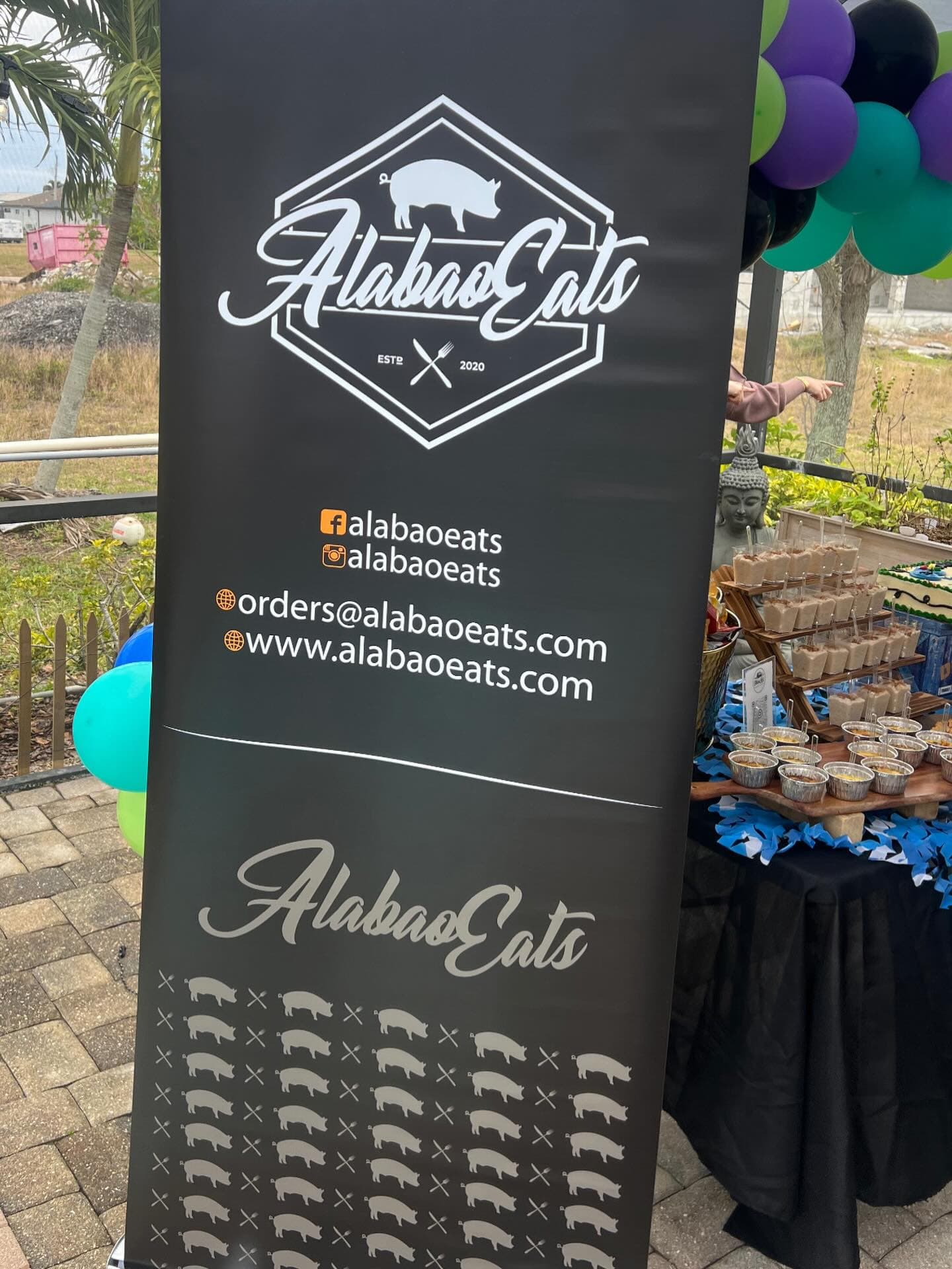 Alabao Eats event banner and dessert table at a Cape Coral gathering